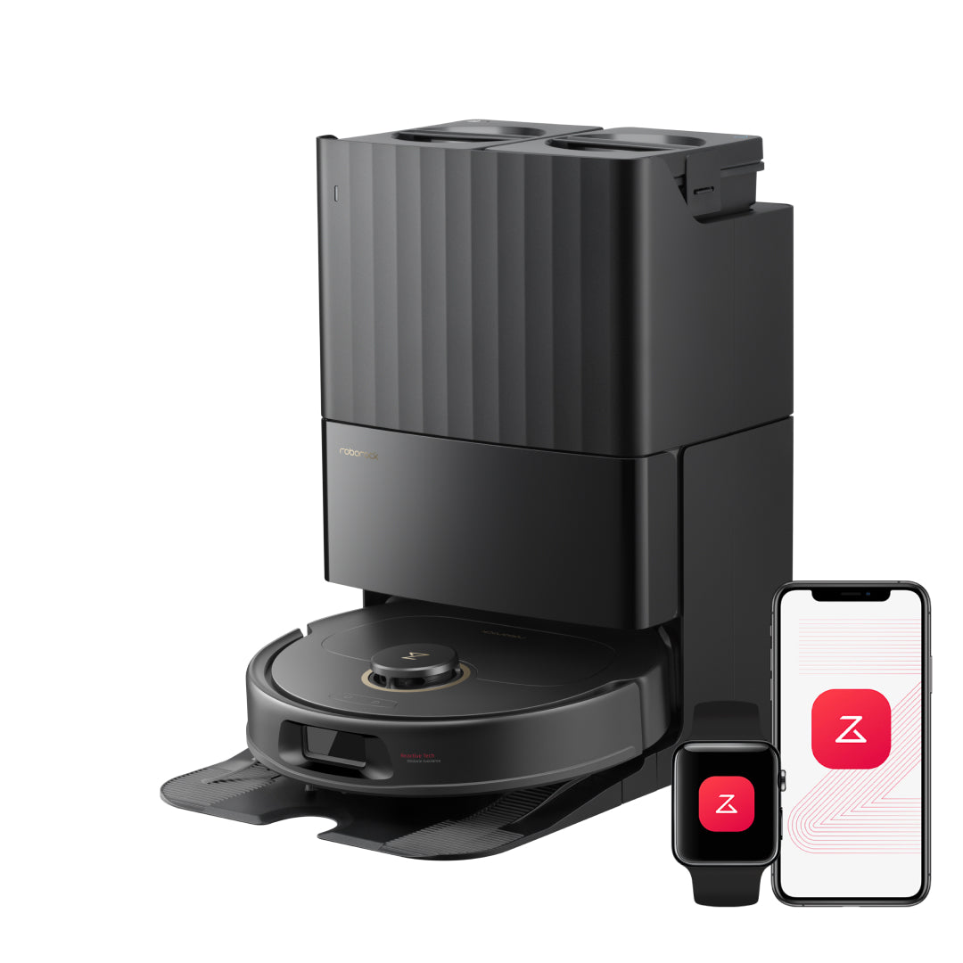 Black Roborock Qrevo S5V robot vacuum in its multifunctional dock beside a phone and smartwatch